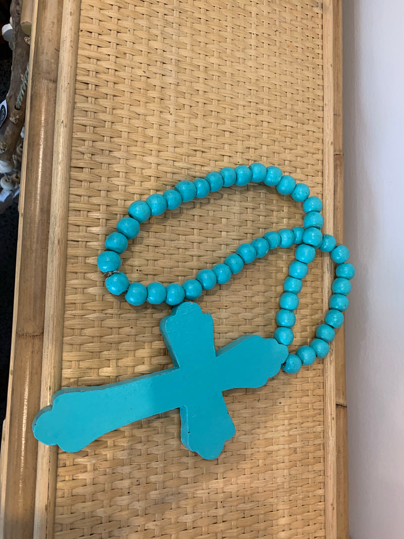 Rustic turquoise timber cross with turquoise beads.