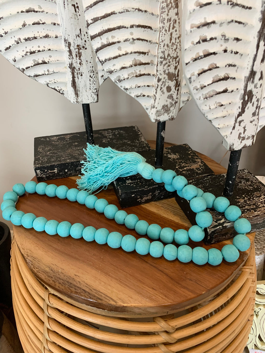 Turquoise timber beads and tassel.