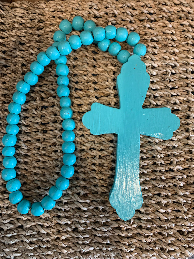 Rustic turquoise timber cross with turquoise beads.