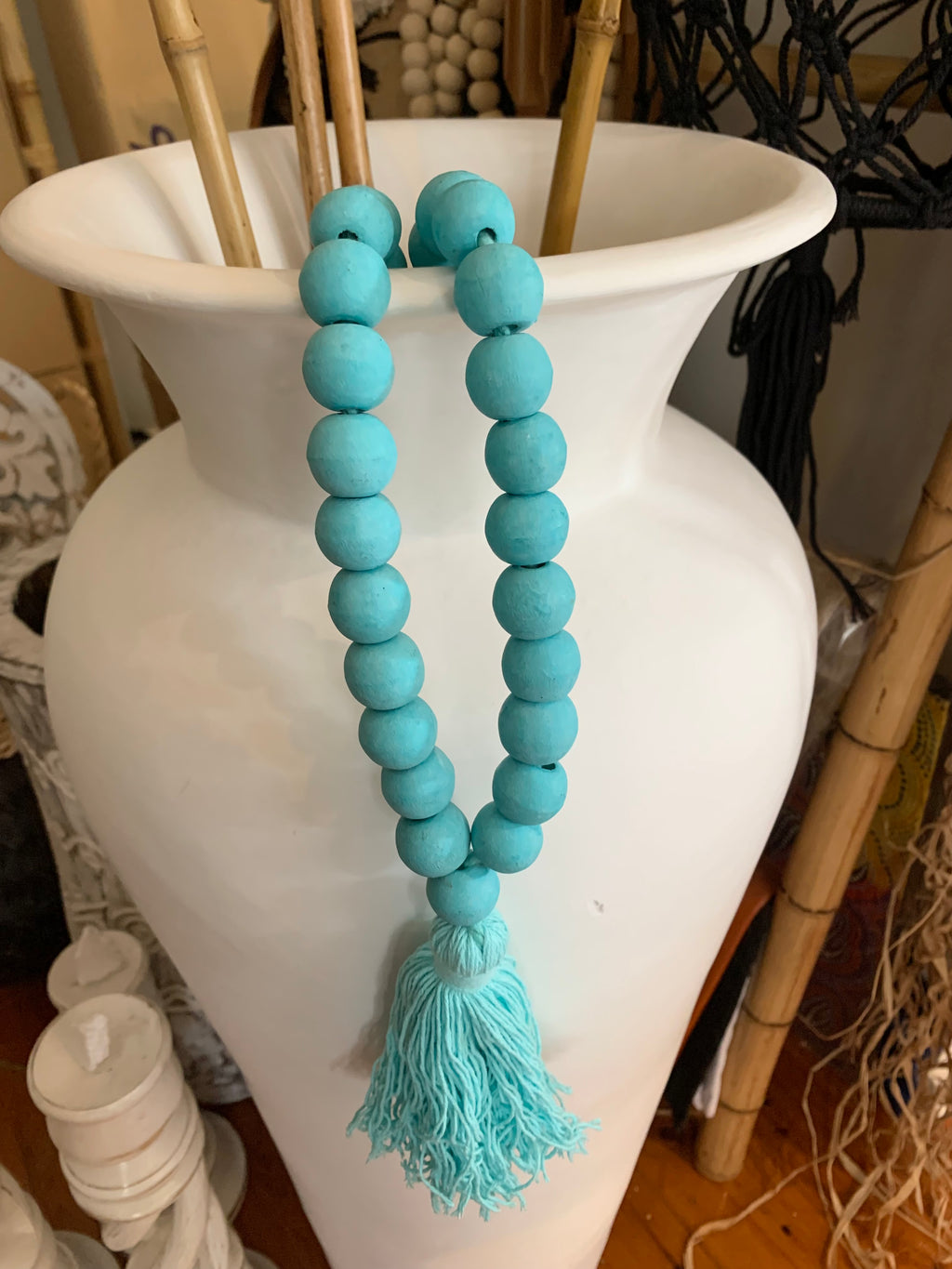 Turquoise timber beads and tassel.