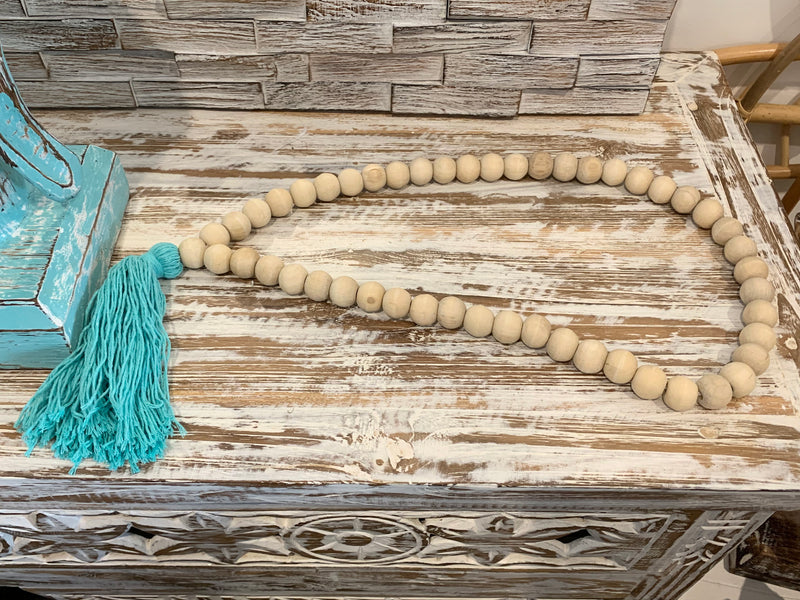 Natural bead and blue tassel hanging.