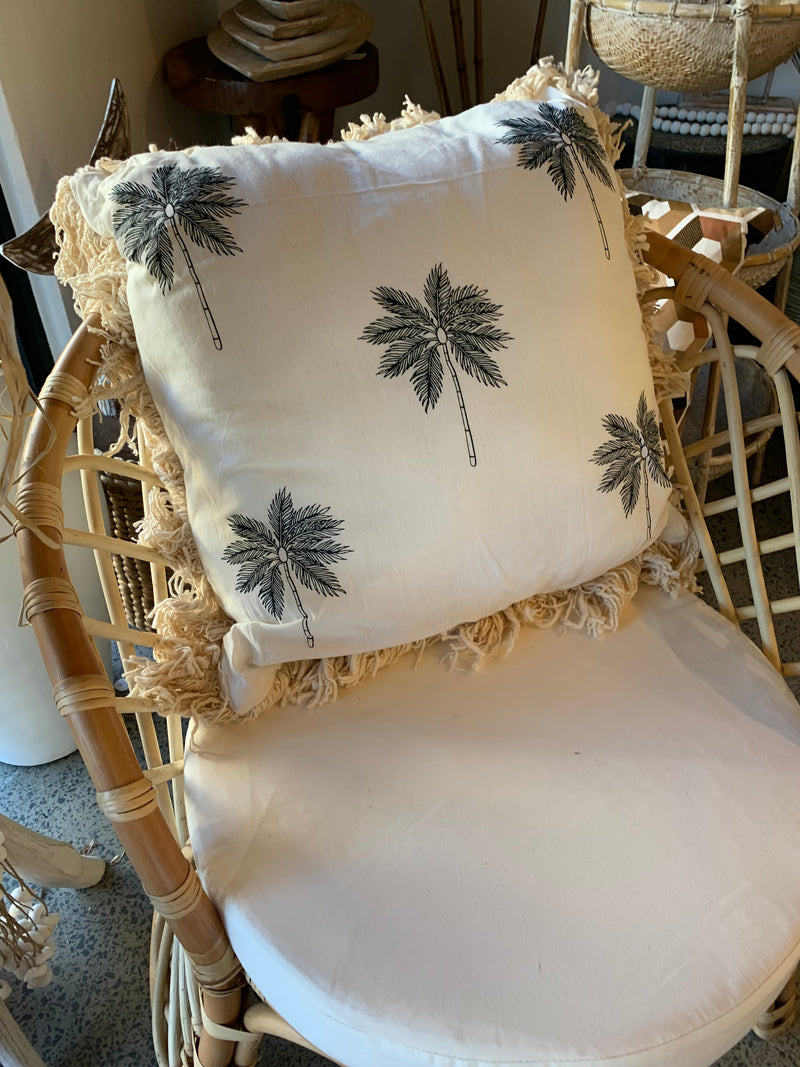 Natural cushion with frill and palm tree design