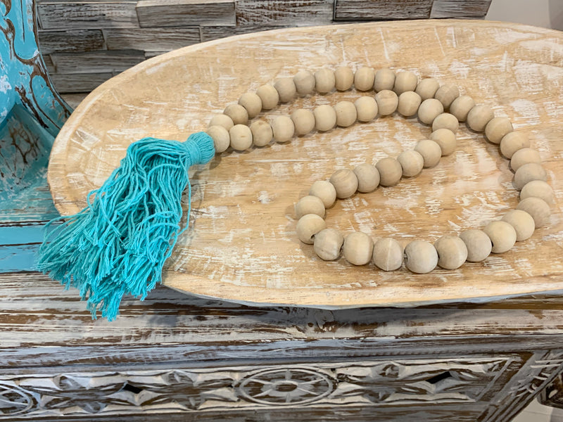 Natural bead and blue tassel hanging.